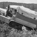 Bedaux expedition; tractor's rear end stuck in mud - 1934