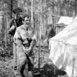 Edgar Abbott cutting Frank Swannell's hair; Nechako survey of 1908